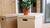 Three boxes stacked on top of each other with a plant in them.