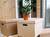 Three boxes stacked on top of each other with a plant in them.